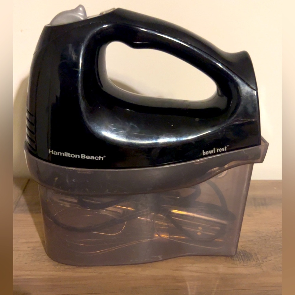 Hamilton Beach hand mixer with attachments and container, works